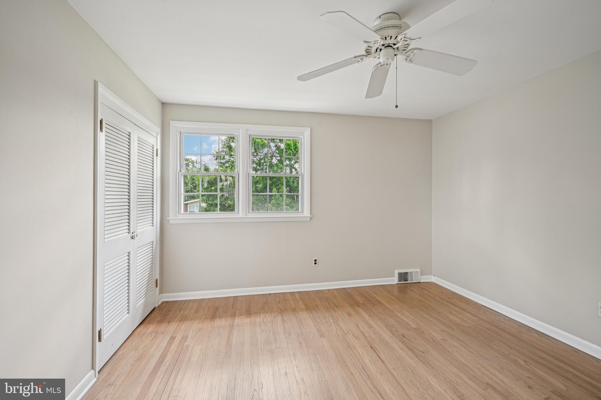 143 Ashbrook Road Cherry Hill, NJ 08034 - Photo 22 of 40 an empty room with a window and a ceiling fan