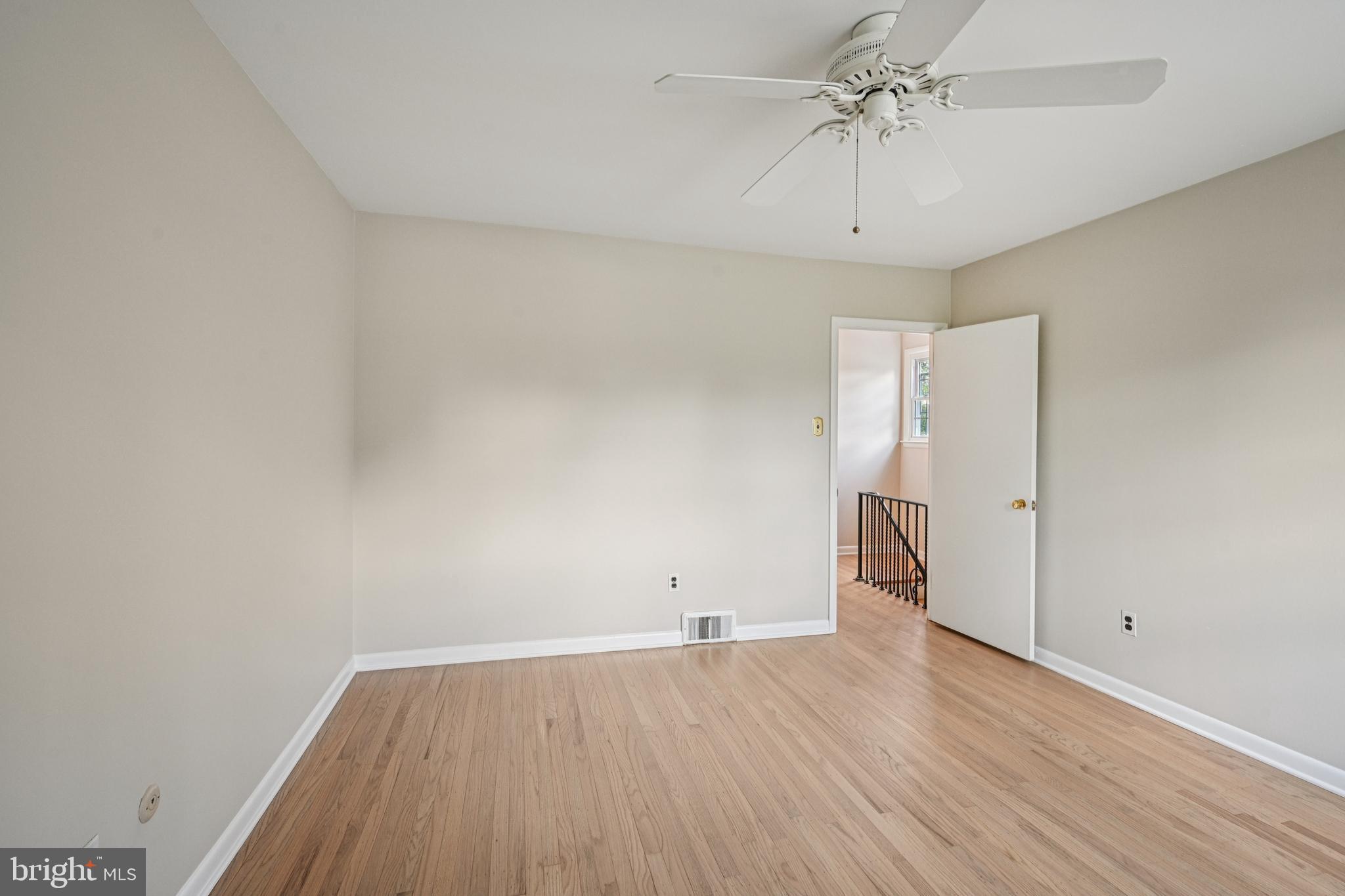 143 Ashbrook Road Cherry Hill, NJ 08034 - Photo 23 of 40 an empty room with wooden floor and ceiling fan