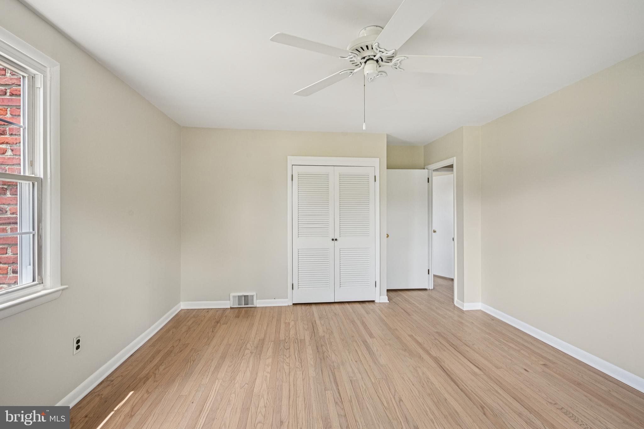 143 Ashbrook Road Cherry Hill, NJ 08034 - Photo 25 of 40 a view of a room with wooden floor and ceiling fan