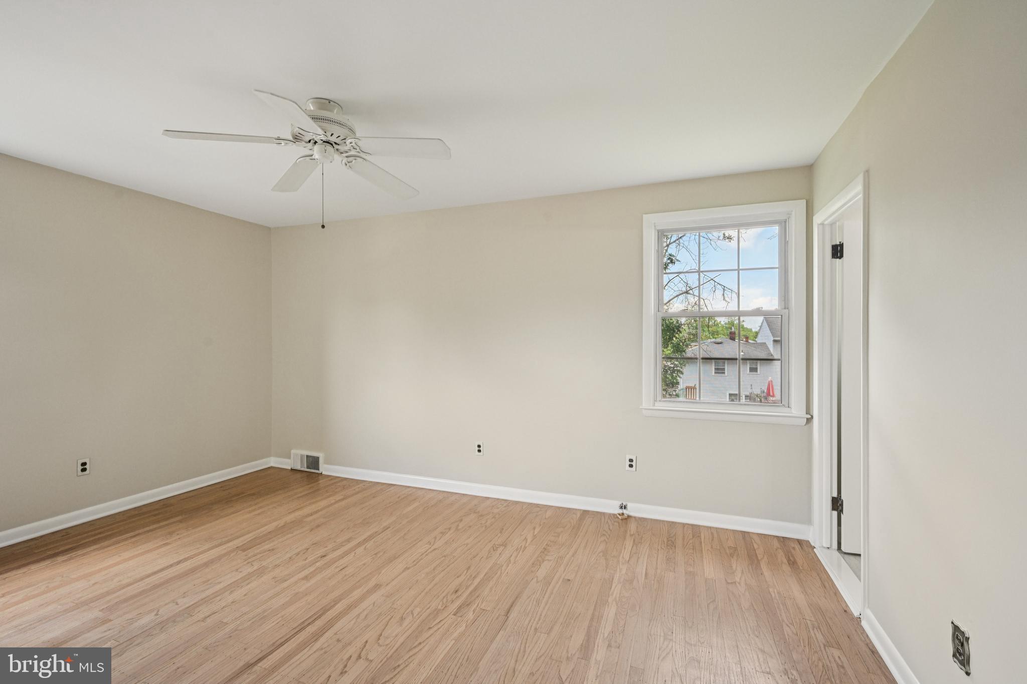 143 Ashbrook Road Cherry Hill, NJ 08034 - Photo 26 of 40 wooden floor in an empty room with a window