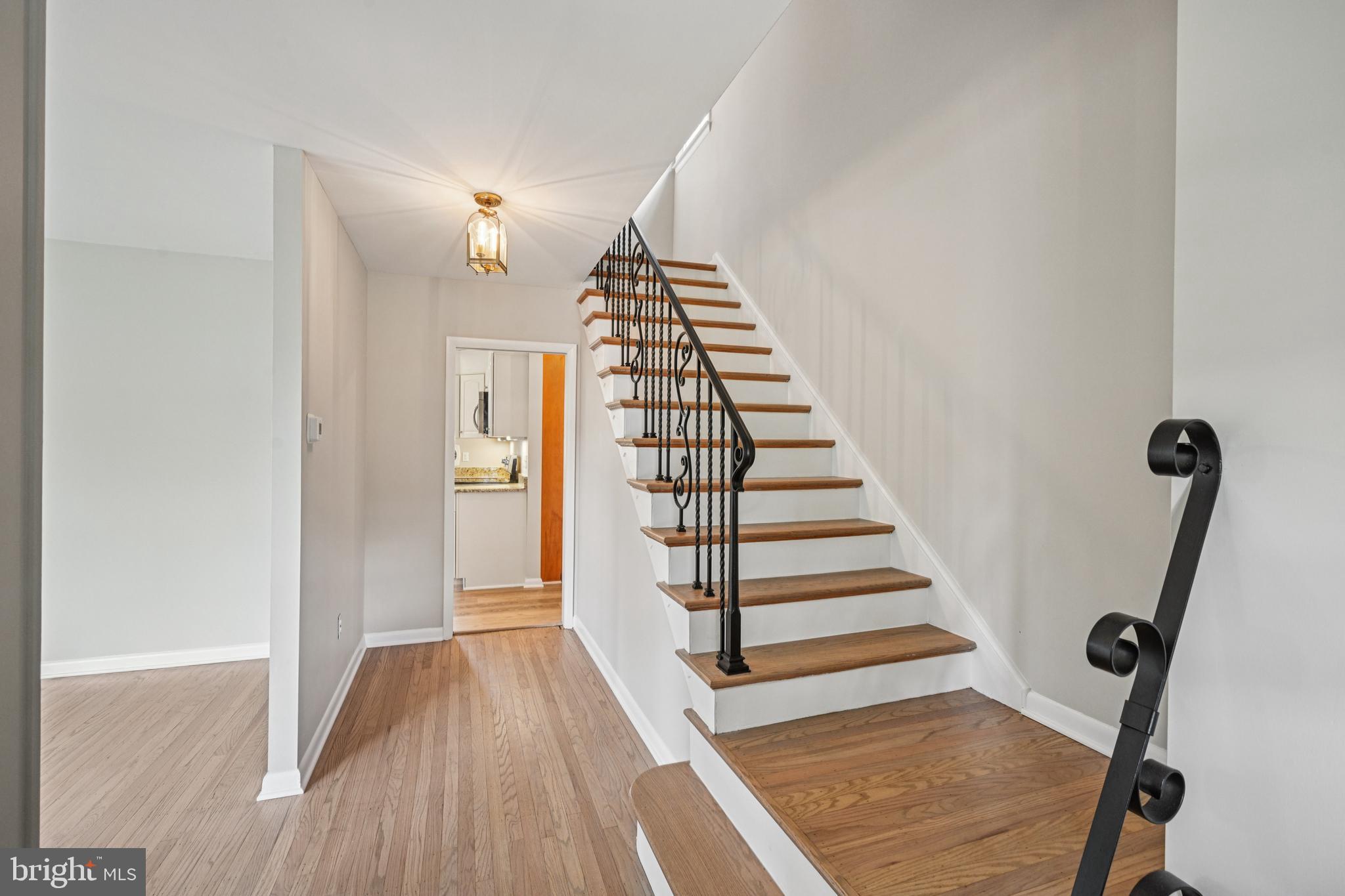143 Ashbrook Road Cherry Hill, NJ 08034 - Photo 6 of 40 a view of a hallway with wooden floor and entryway