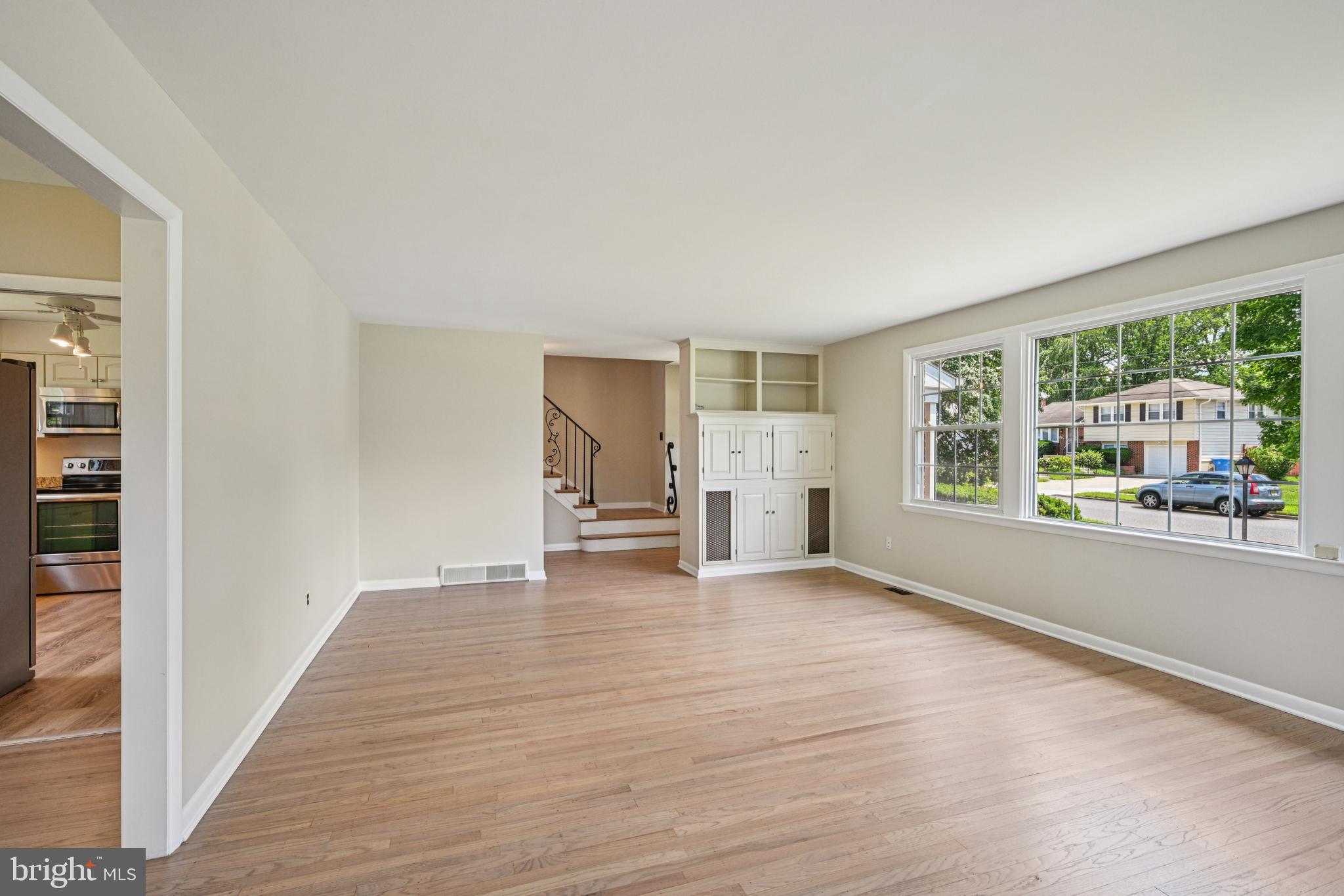 143 Ashbrook Road Cherry Hill, NJ 08034 - Photo 9 of 40 a view of empty room with wooden floor and fan