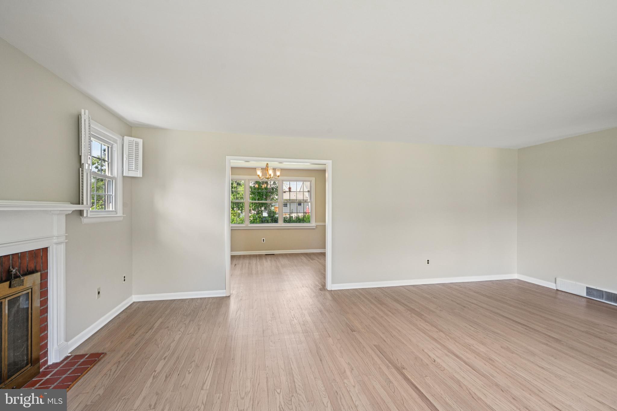 143 Ashbrook Road Cherry Hill, NJ 08034 - Photo 10 of 40 an empty room with wooden floor and windows