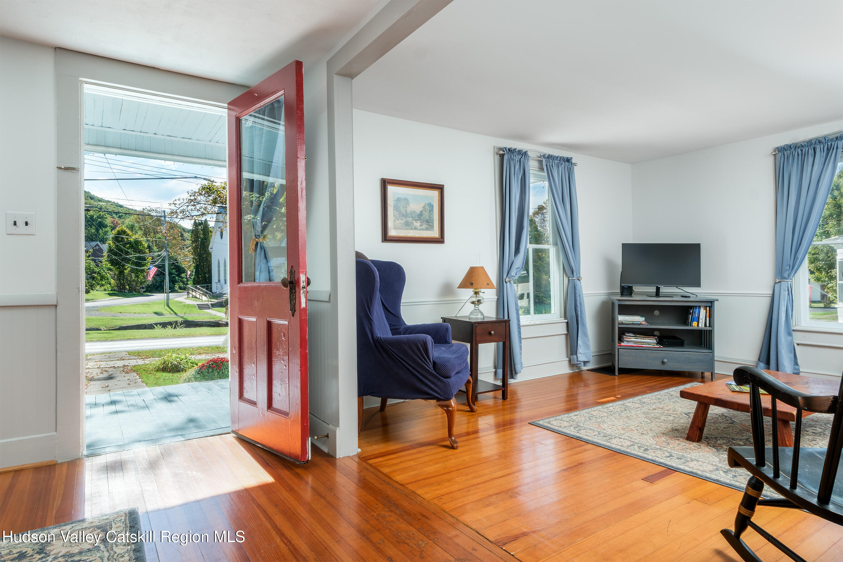 70 Case Hill Road Treadwell, NY 13846 - Photo 13 of 50 a living room with furniture and a floor to ceiling window