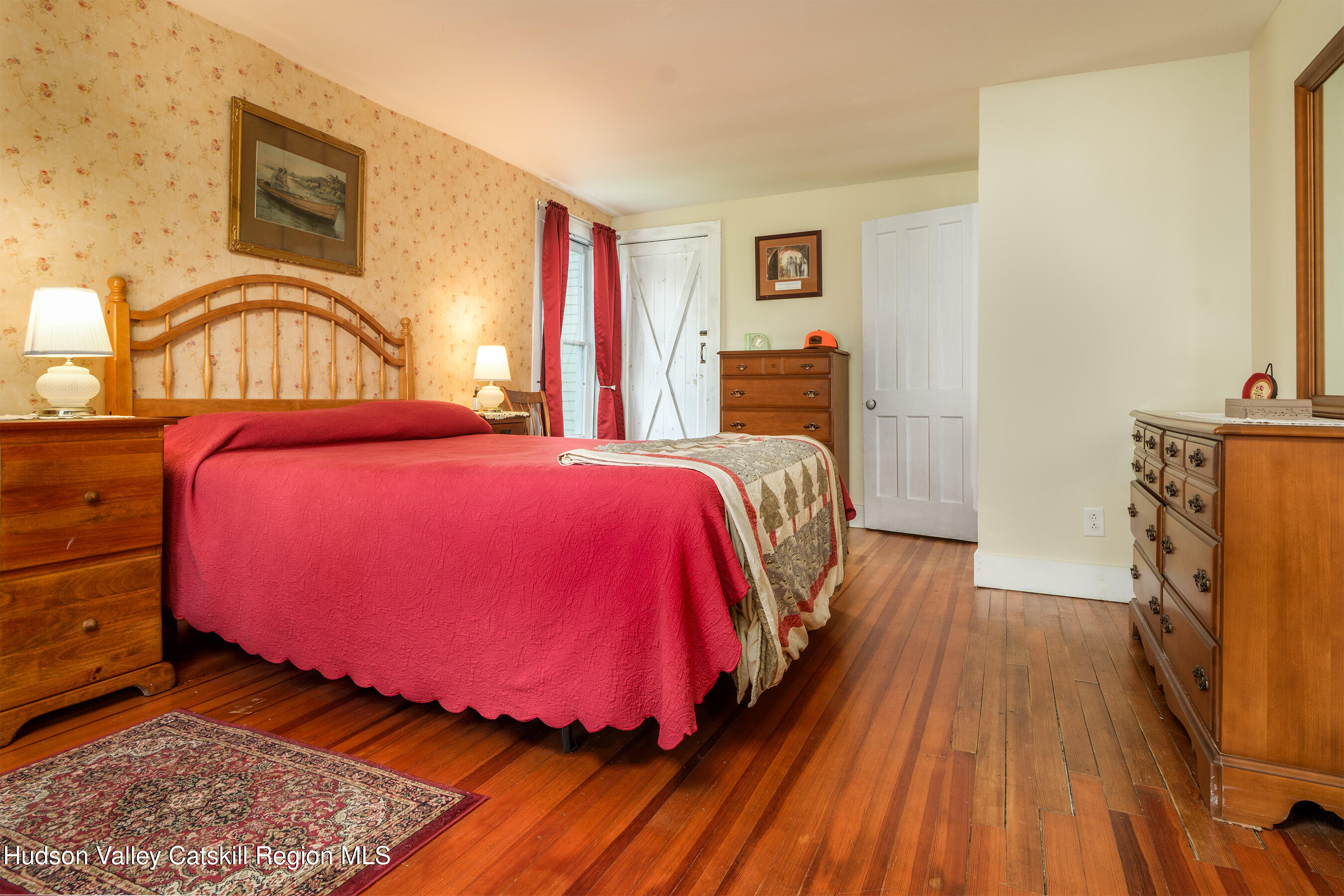 70 Case Hill Road Treadwell, NY 13846 - Photo 18 of 50 a bedroom with a bed and wooden floor