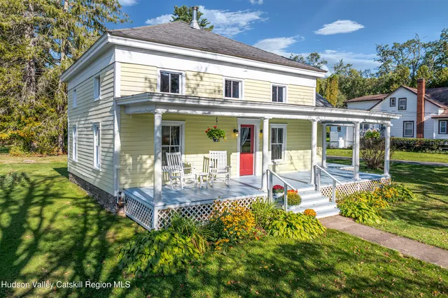 front view of a house with a yard