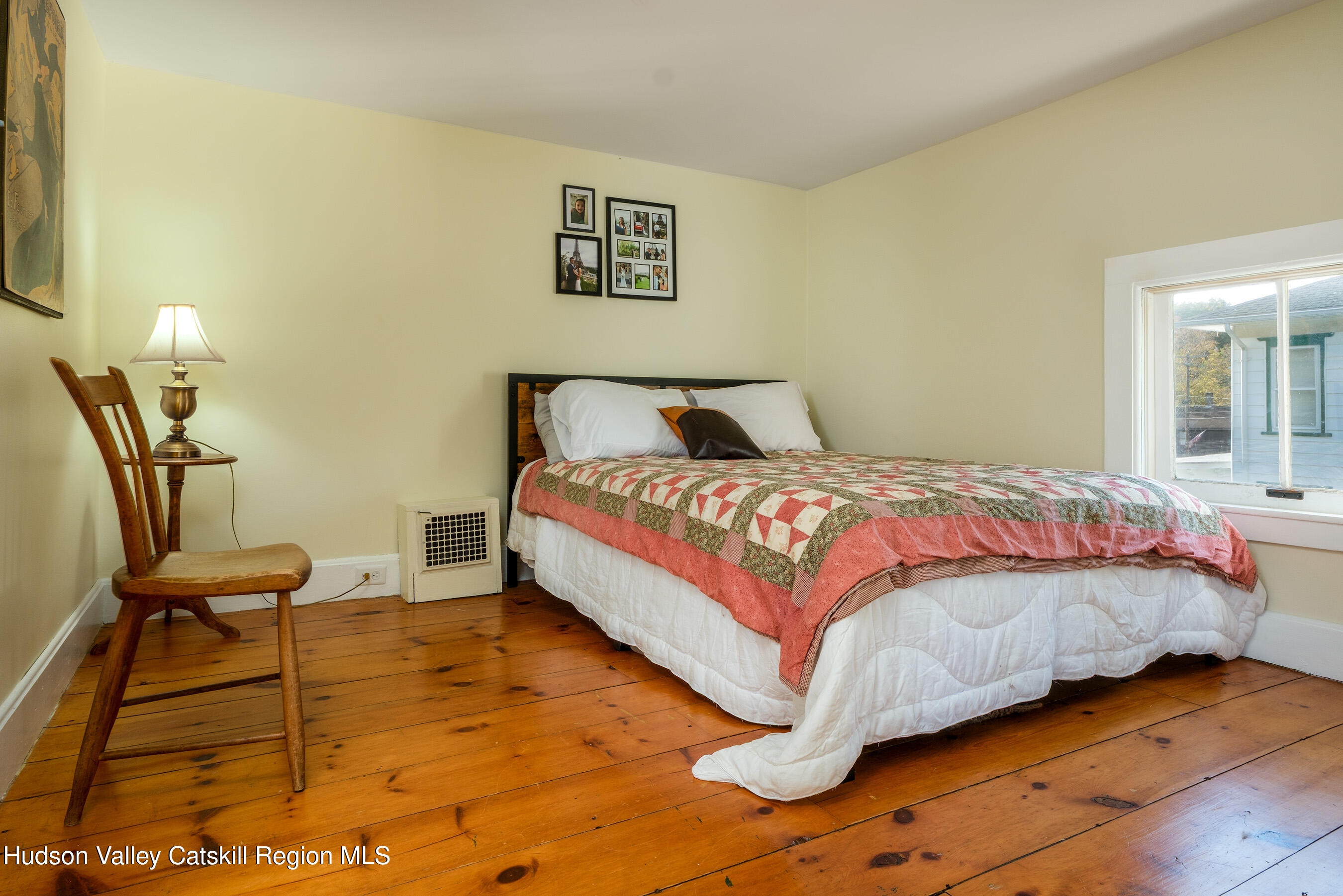 70 Case Hill Road Treadwell, NY 13846 - Photo 31 of 50 a bedroom with a bed and a chair