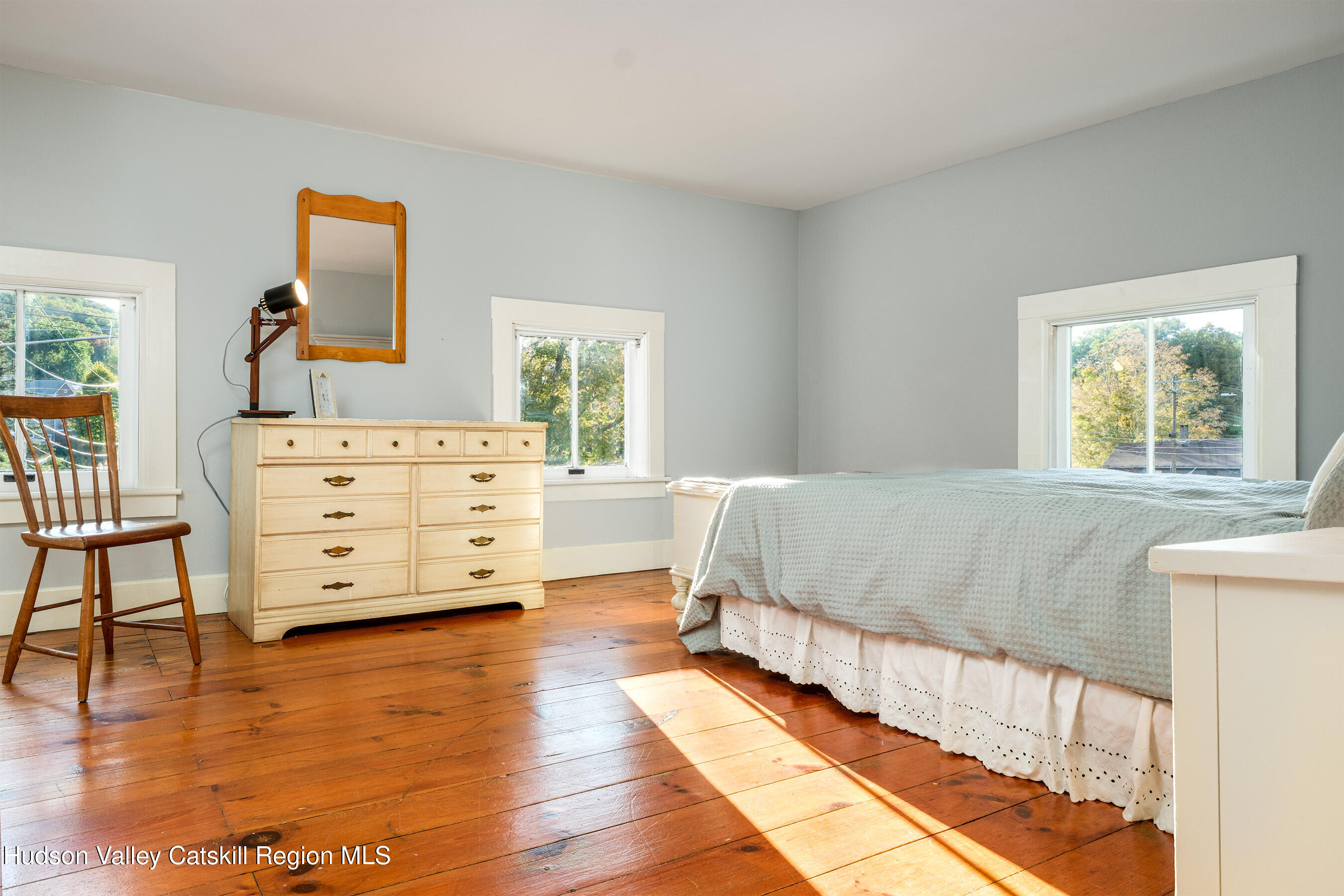 70 Case Hill Road Treadwell, NY 13846 - Photo 32 of 50 a spacious bedroom with a bed and a dresser