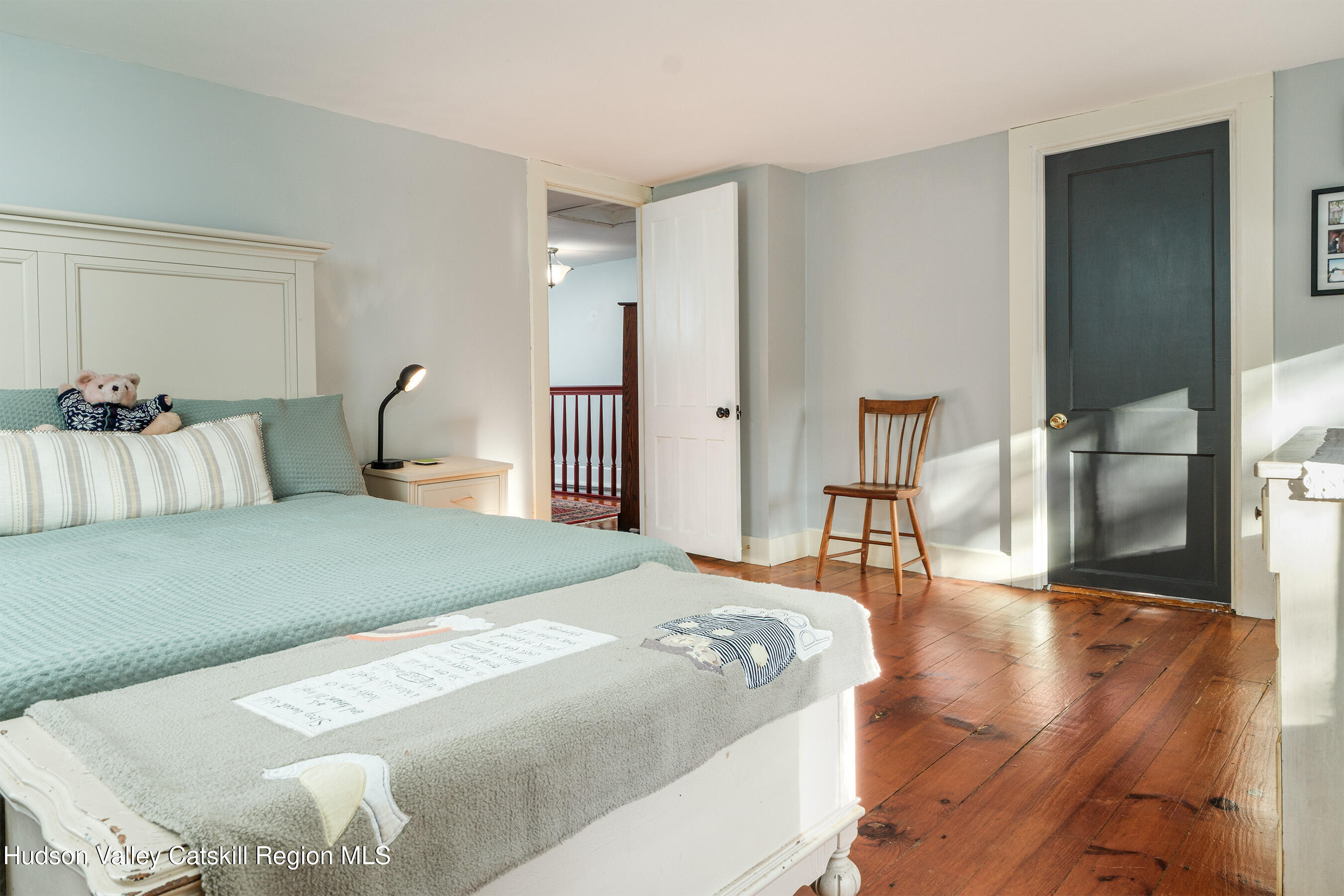 70 Case Hill Road Treadwell, NY 13846 - Photo 33 of 50 a bedroom with a bed and wooden floor