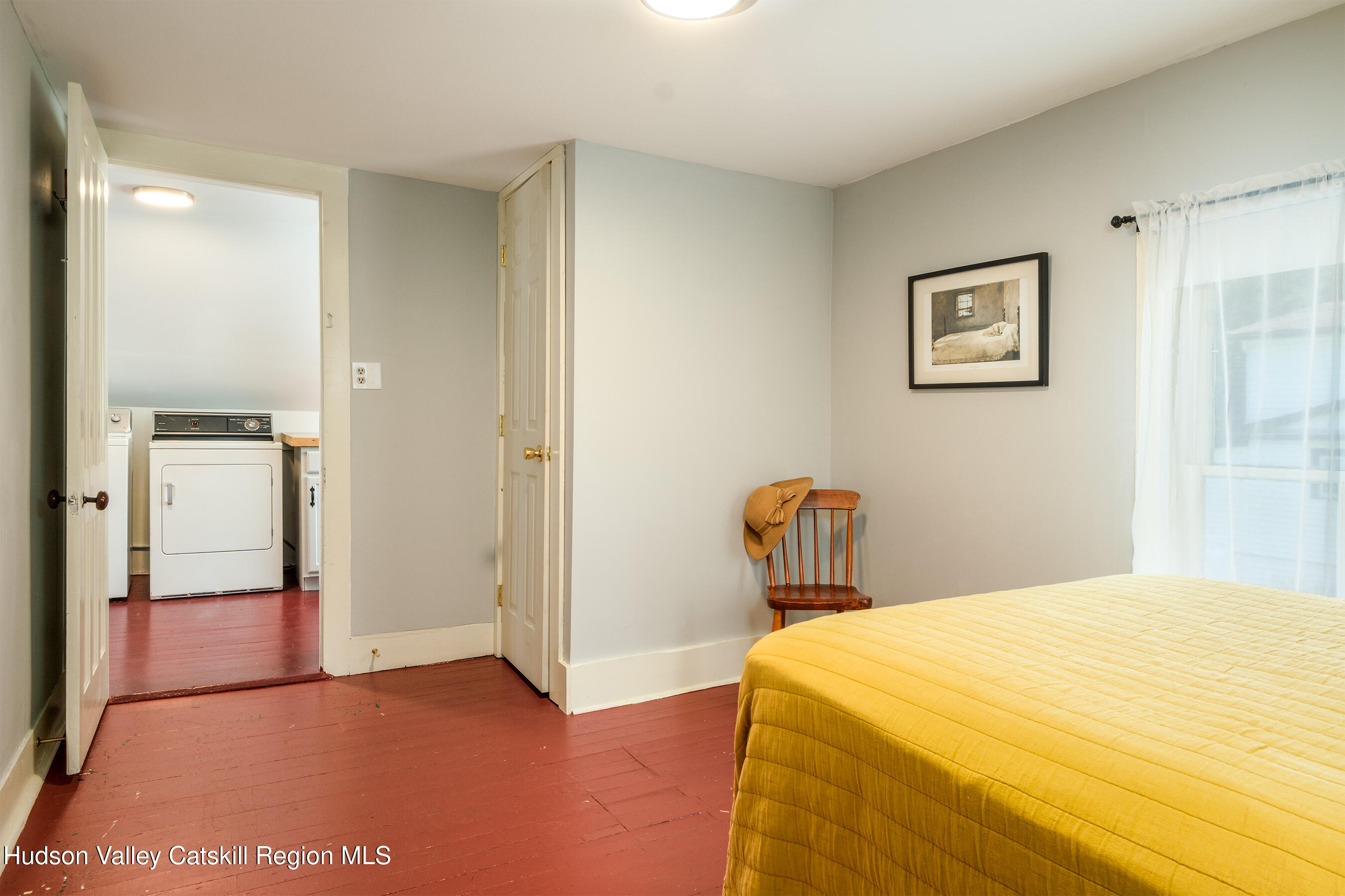 70 Case Hill Road Treadwell, NY 13846 - Photo 39 of 50 a bedroom with a bed and wooden floor