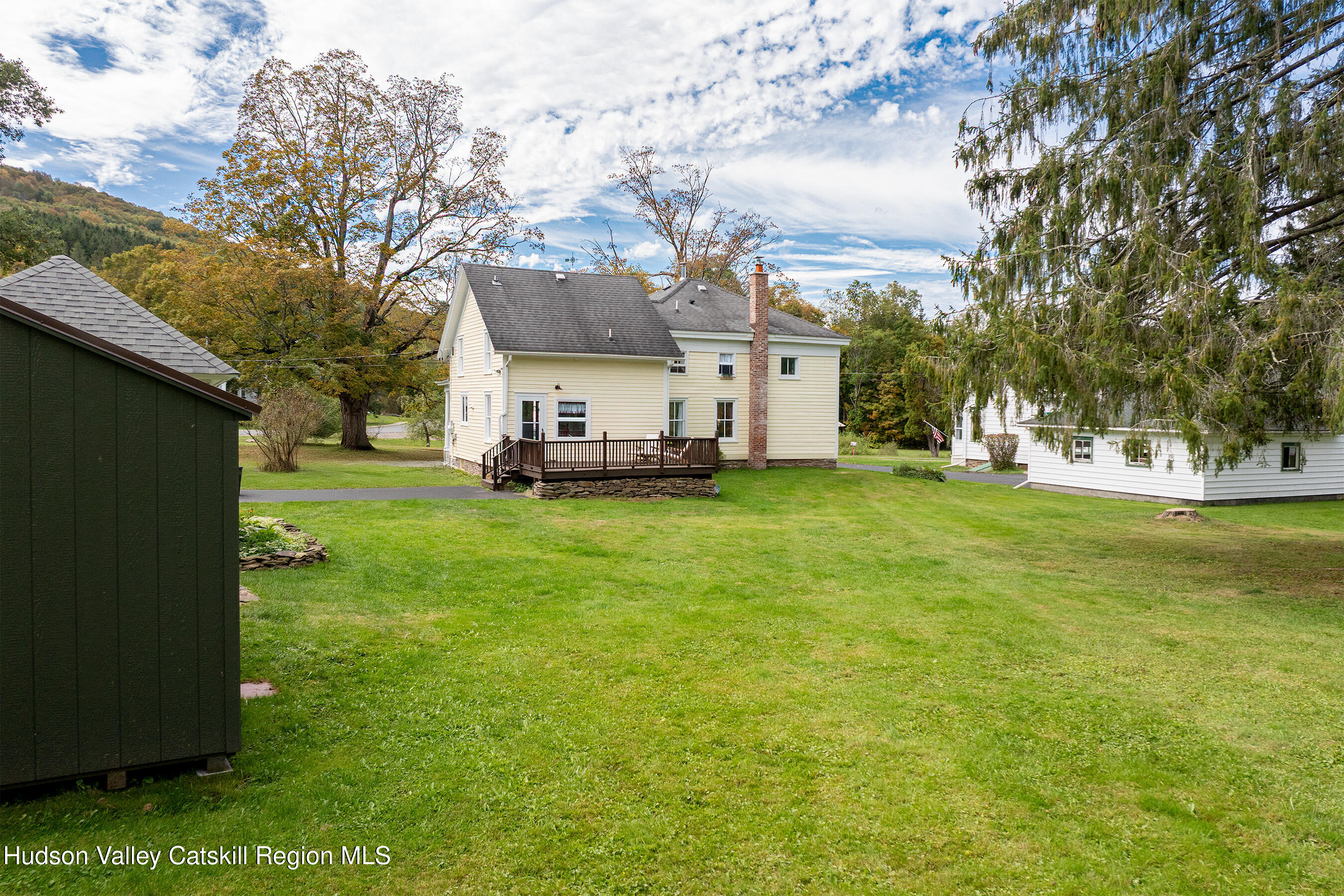 70 Case Hill Road Treadwell, NY 13846 - Photo 43 of 50 a view of a house with a big yard and large trees