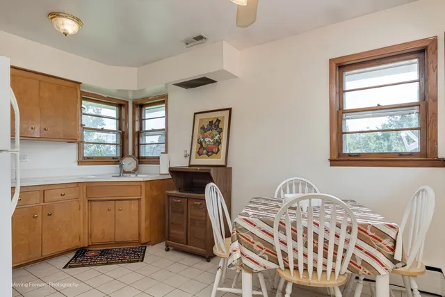 a view of a dining room with furniture and window