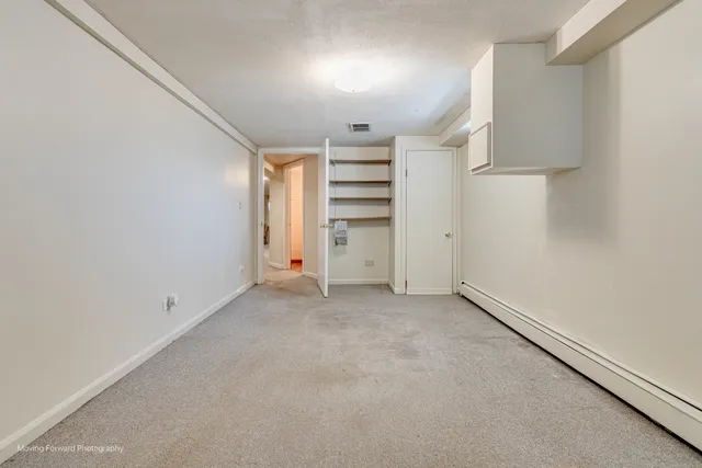 a bathroom with a granite countertop sink a toilet a mirror and shower