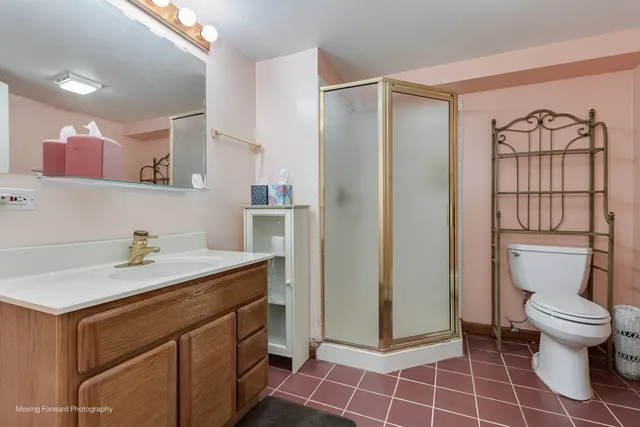 a living room with furniture and a lamp