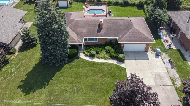 an aerial view of a house with a garden