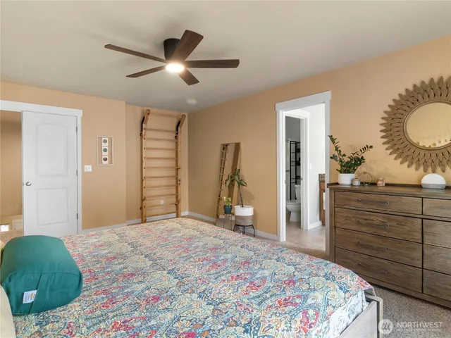 a bedroom with a bed and a dresser