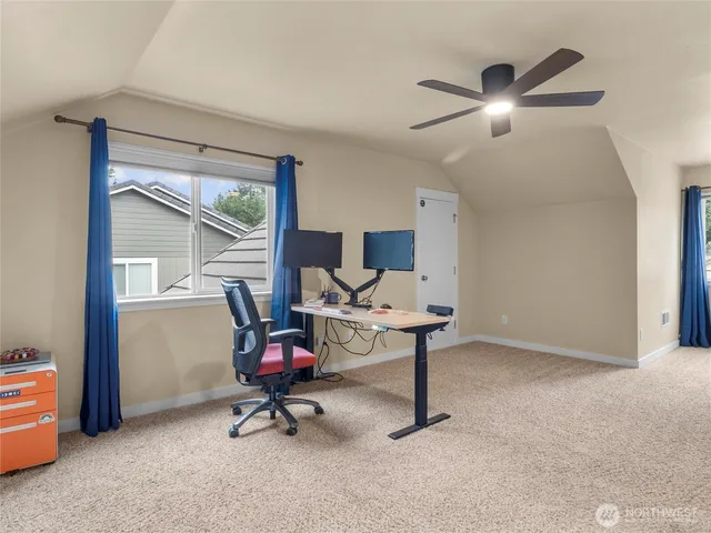 a view of a workspace with furniture