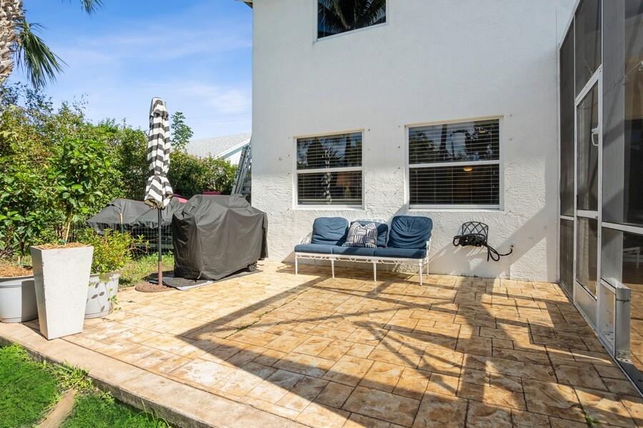 6031 Robinson Street Jupiter, FL 33458 - Photo 31 of 44 34_6031RobinsonSt_85_Patio_Small