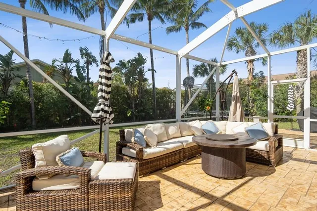 a view of a patio with couches chairs and a table and chairs