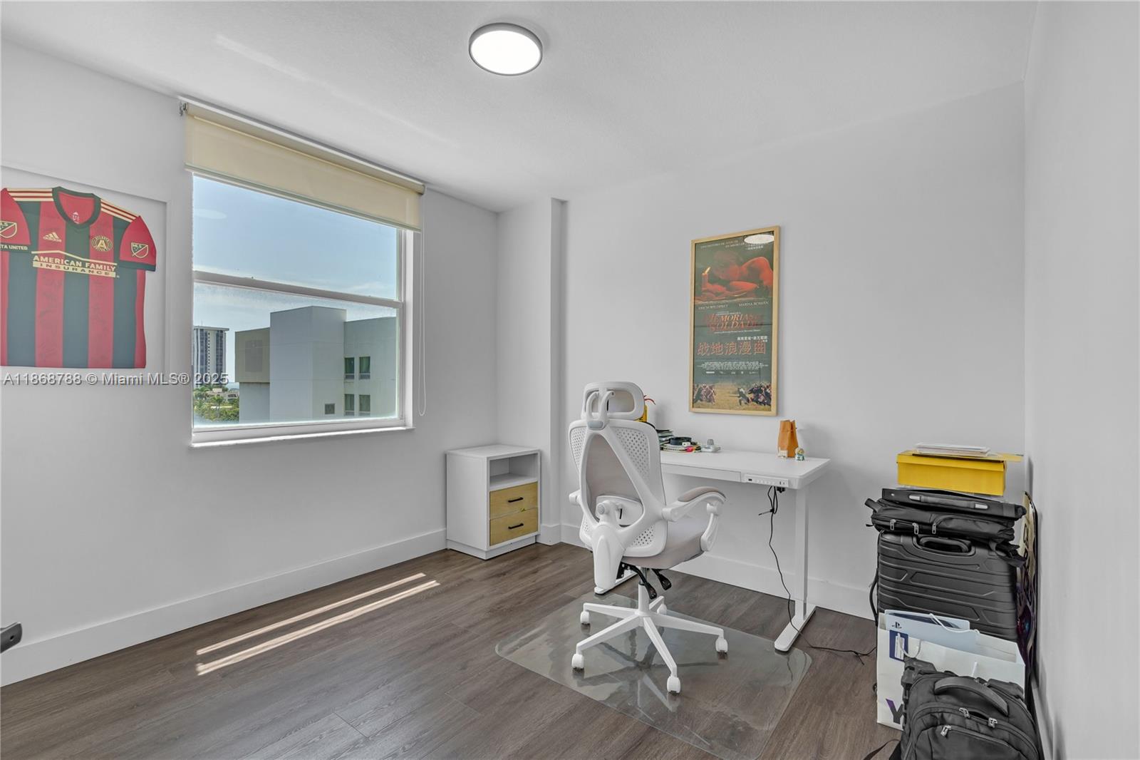 1723 Southwest 2nd Avenue, Unit 902 Miami, FL 33129 - Photo 16 of 33 a work room with furniture and a wooden floor