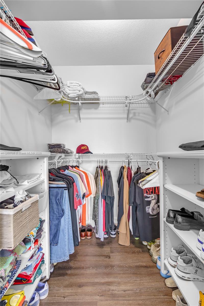 1723 Southwest 2nd Avenue, Unit 902 Miami, FL 33129 - Photo 21 of 33 a view of walk in closet with clothes and shoes