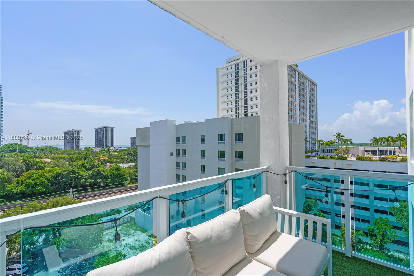 1723 Southwest 2nd Avenue, Unit 902 Miami, FL 33129 - Photo 23 of 33 a view of a balcony with chairs