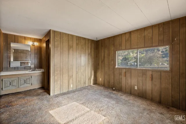 a bathroom with a sink a mirror and a shower