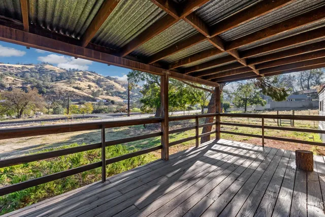 a view of two chairs in the balcony