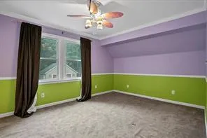 a view of room with window and fan