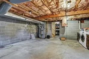 a view of empty room with wooden walls