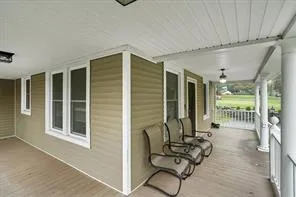 a building outdoor space with patio furniture and potted plants