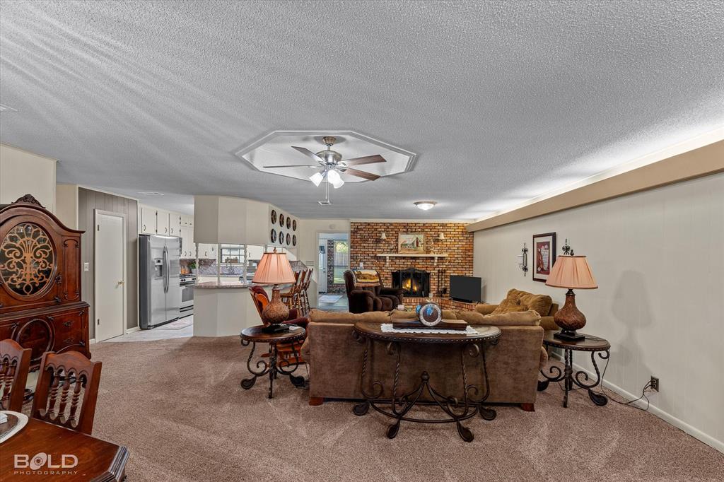 202 Butler Street Springhill, LA 71075 - Photo 12 of 38 a view of a livingroom with furniture and a to ceiling window