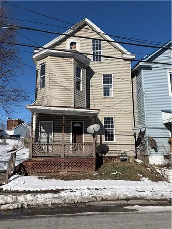 a front view of a house with garage