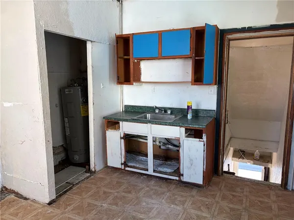 a kitchen with stainless steel appliances granite countertop a refrigerator and a stove