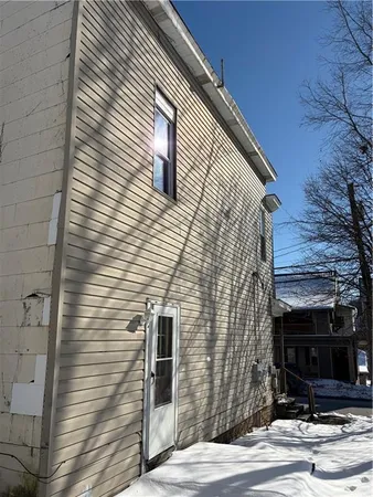 a view of a house with a street
