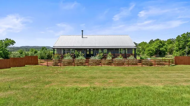 a view of swimming pool and patio with a garden