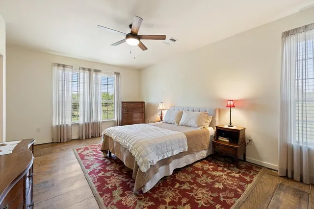 a bedroom with a large bed and a window