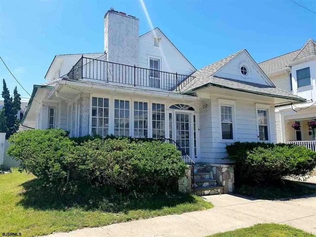 a view of a house with a garden