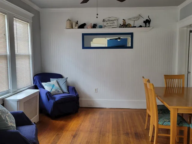 a living room with furniture and window