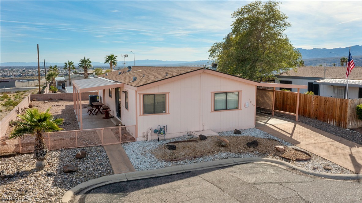 1609 Cajon Court Laughlin, NV 89029 - Photo 55 of 69 View of front of home featuring a mountain view, a fenced backyard, and a patio area
