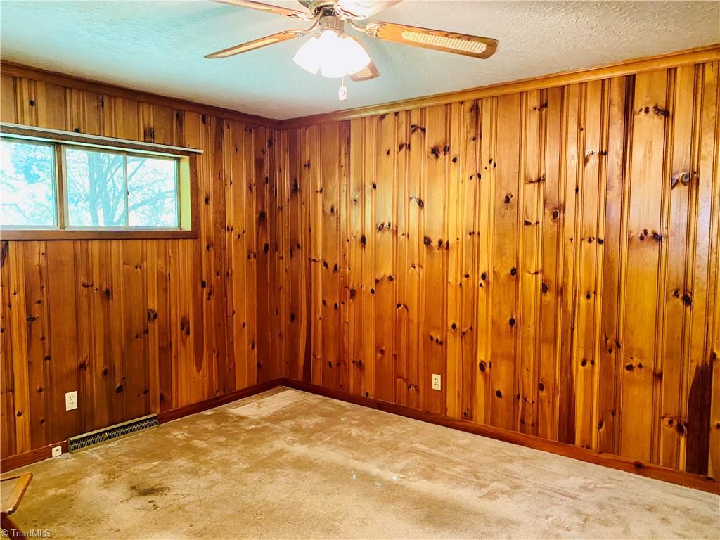 825 Hickory Chapel Road High Point, NC 27260 - Photo 3 of 16 Vintage knotty pine paneling in dining/den