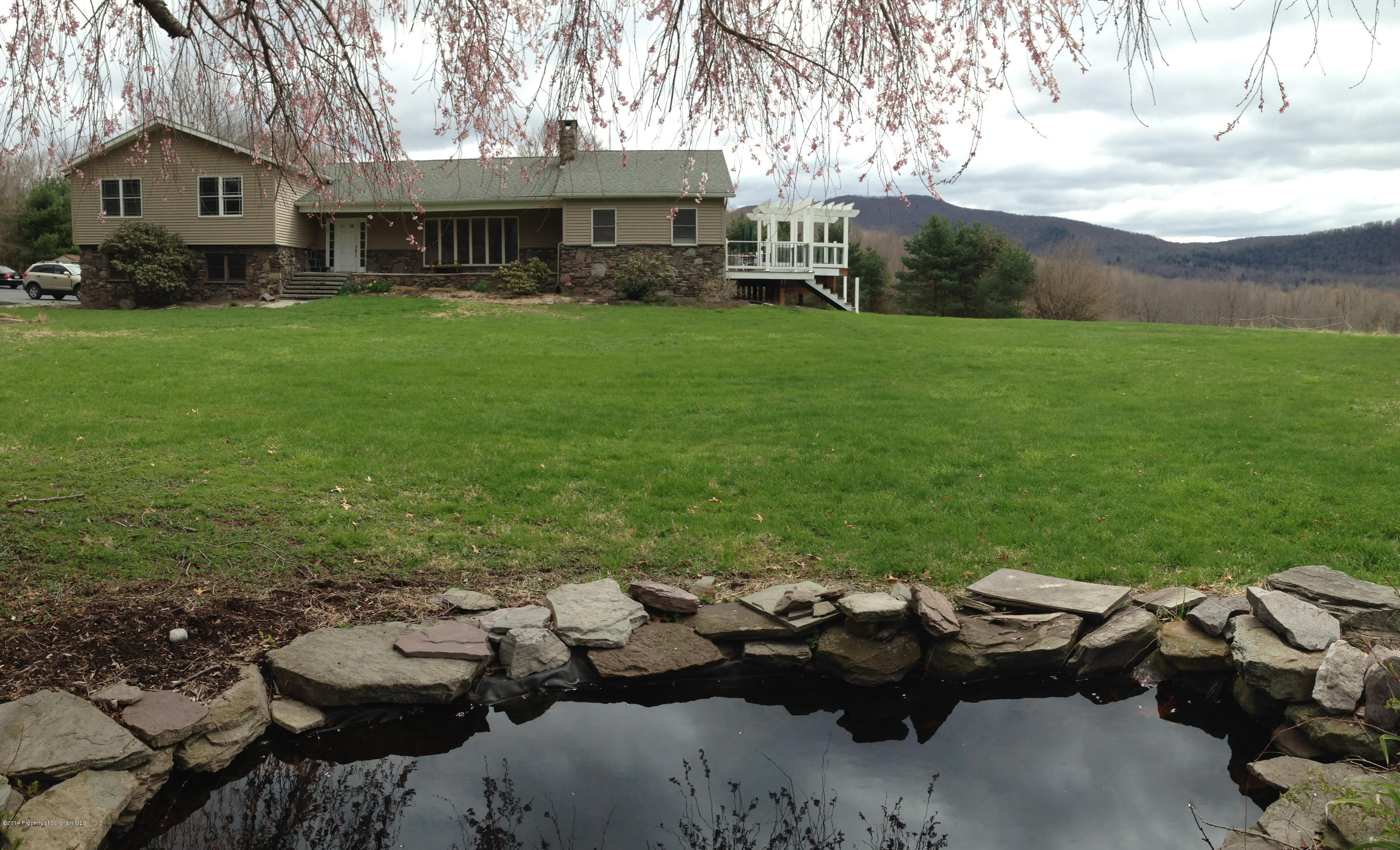 20 Green Acres Road Tunkhannock, PA 18657 - Photo 1 of 40 a backyard of a house with table and chairs