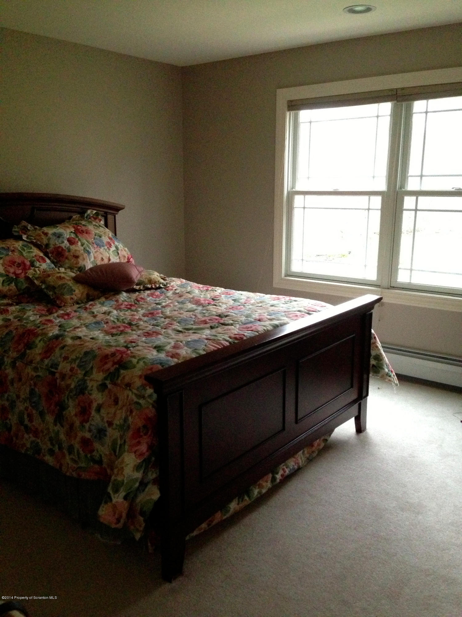 20 Green Acres Road Tunkhannock, PA 18657 - Photo 13 of 40 a bed sitting in a bedroom next to a window