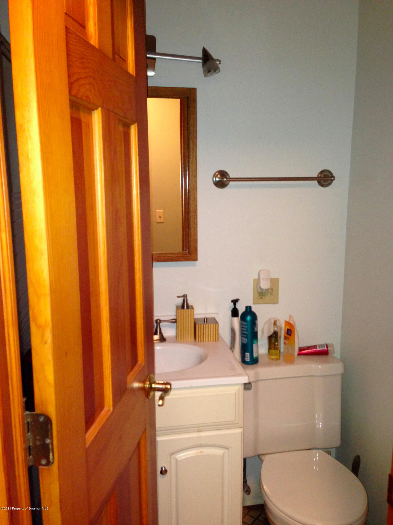 20 Green Acres Road Tunkhannock, PA 18657 - Photo 36 of 40 a bathroom with a toilet sink and mirror
