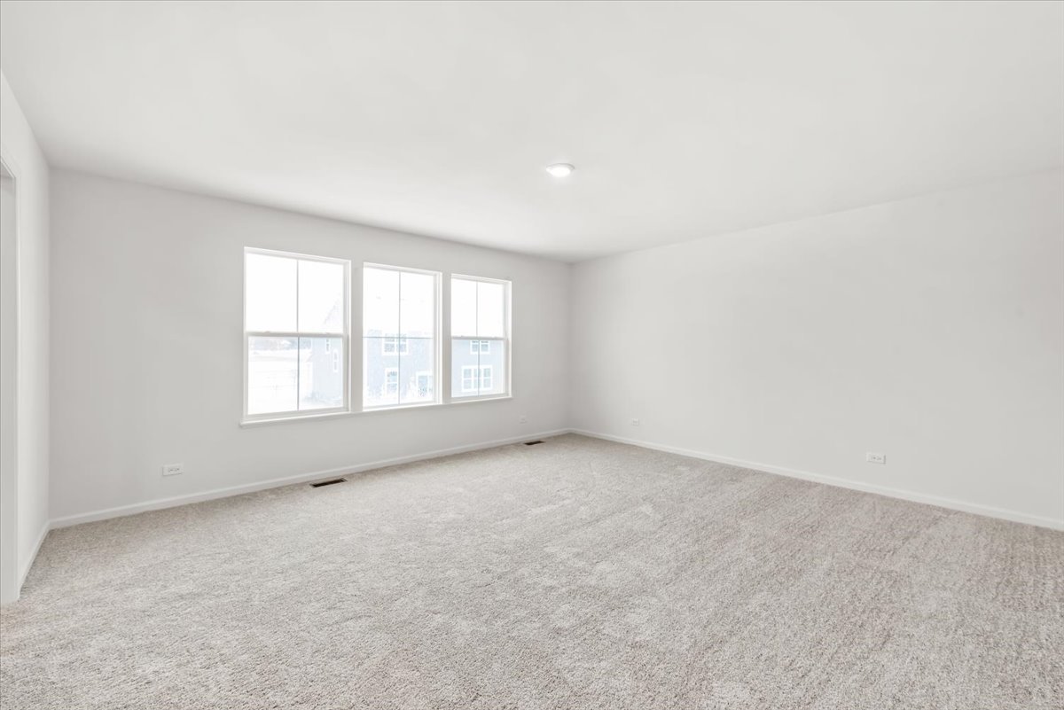 102 Hedgerow Drive Elgin, IL 60124 - Photo 18 of 48 an empty room with windows