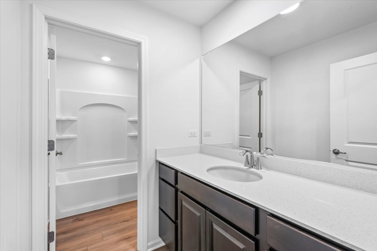 102 Hedgerow Drive Elgin, IL 60124 - Photo 24 of 48 a bathroom with a sink and a mirror