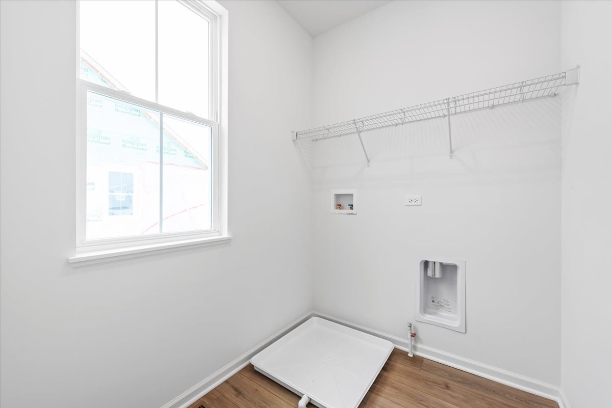 102 Hedgerow Drive Elgin, IL 60124 - Photo 29 of 48 a view of small space with wooden floor and windows