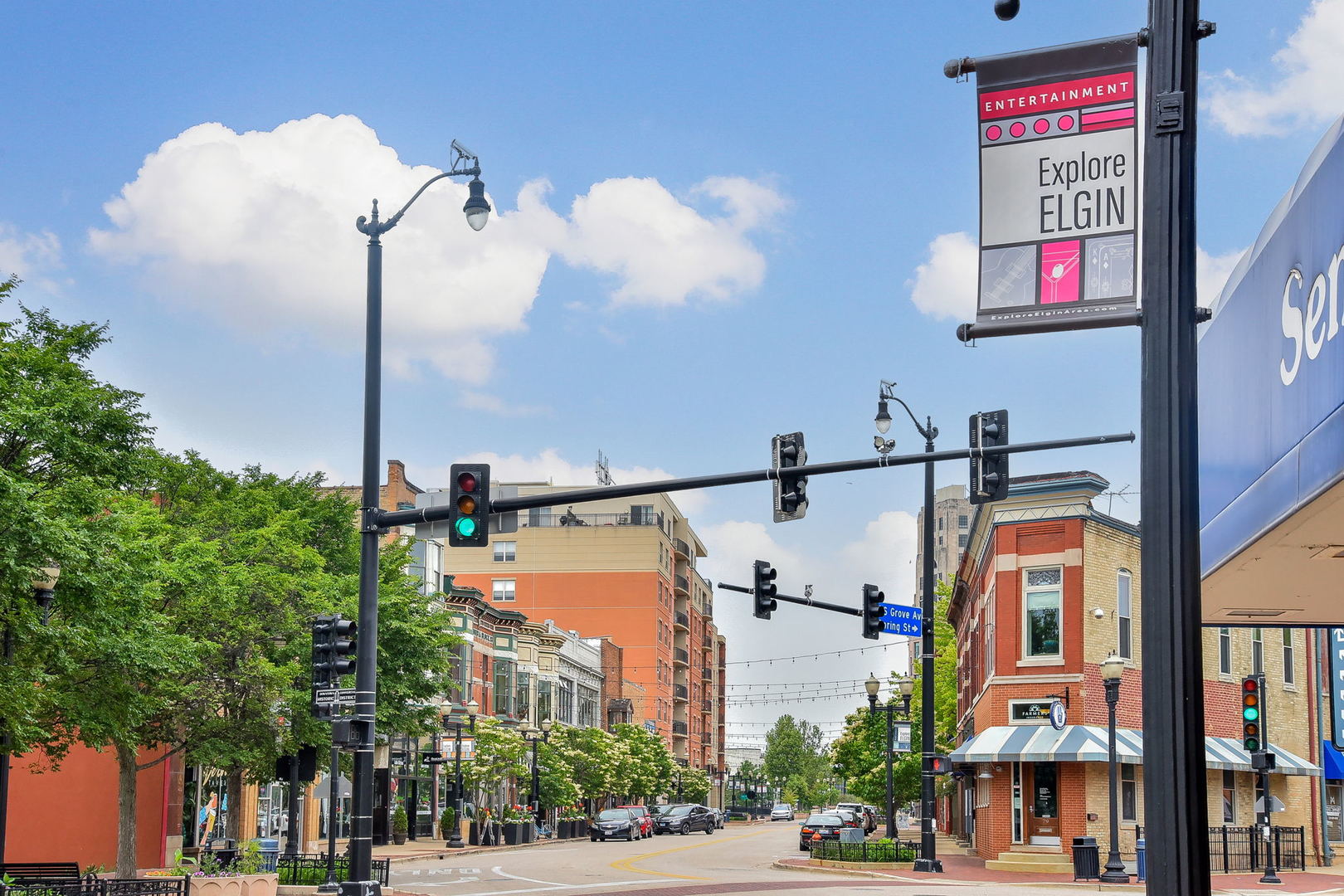 102 Hedgerow Drive Elgin, IL 60124 - Photo 34 of 48 a street sign on a street next to a building