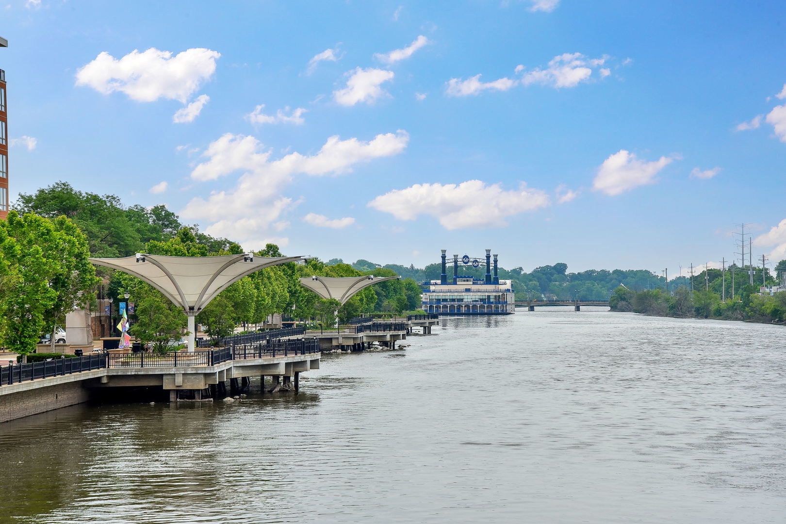 102 Hedgerow Drive Elgin, IL 60124 - Photo 35 of 48 a view of a lake with lawn chairs