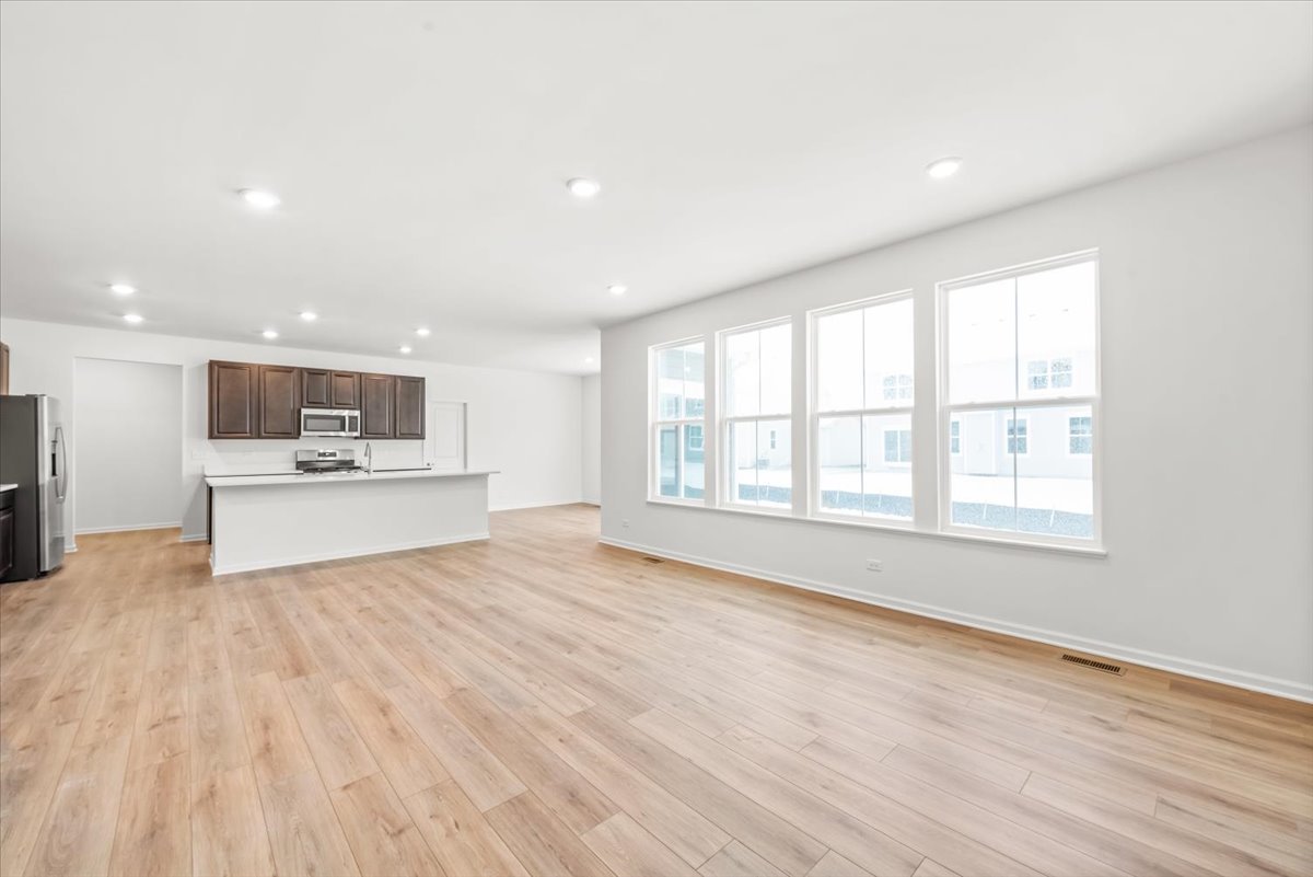 102 Hedgerow Drive Elgin, IL 60124 - Photo 9 of 48 a view of kitchen with wooden floor and outdoor space